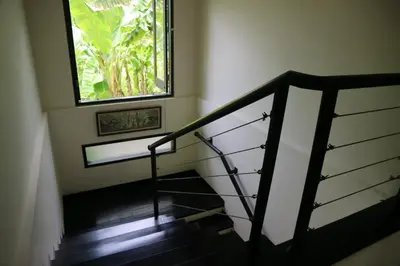 a stairway with a window and a stair case at Villa Mertasari 10C 4 Bedroom with Swimming pool! in Sanur