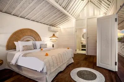 a bedroom with a large bed in a room at Villa Cyma by Alfred in Bali in Seminyak