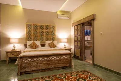 a bedroom with a large bed in a room at Sunset Paradise Villa Nusa Dua in Nusa Dua