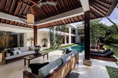an outdoor living room with a couch and a table at Villa Amara Pradi - 550m to Petitenget Beach in Seminyak