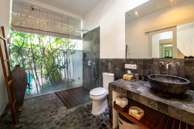 a bathroom with a sink and a toilet at Villa Gallici Seminyak in Seminyak