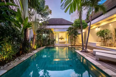 a swimming pool in the backyard of a villa at Villa Gallici Seminyak in Seminyak
