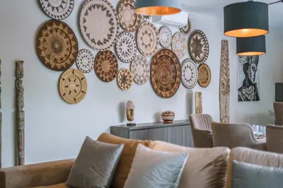 a room with plates hanging on the wall at Villa Batik - Brand New & Stylish 3BR Villa in Seminyak! in Seminyak