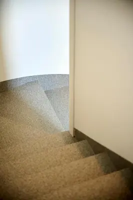 an open door to a room with a staircase at Adamare Villa Umalas in Kerobokan