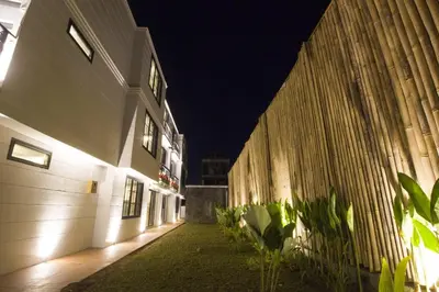 an empty alley with a building at night at PAMELA BALI in Kerobokan