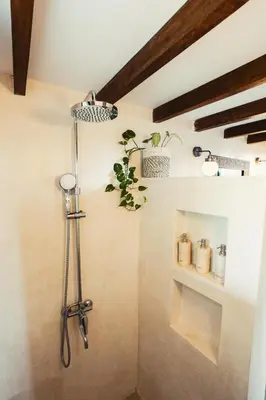 a shower in the corner of a room at Bali Adua Villa in Seminyak