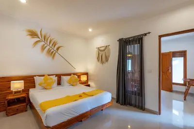 a bedroom with a large bed and a window at Vast 5bd Villa with Garden and Private Pool 250m to Beach in Seminyak