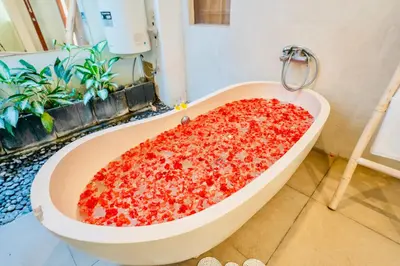 a large pizza in a bath tub in a bathroom at Villa Olli in Seminyak