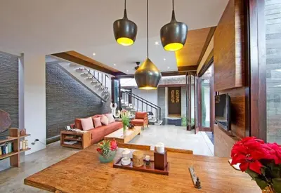 a living room with a couch and a table at Villa Canthy@Seminyak in Seminyak