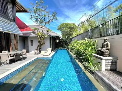 a swimming pool in the backyard of a house at Villa Canthy@Seminyak in Seminyak