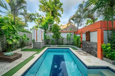 a swimming pool in the backyard of a house at Nameera Villa in Seminyak