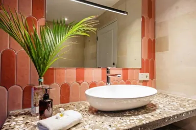 a bathroom with a large bowl sink on a counter at Baliani Beauty in Seminyak