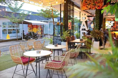 a group of tables and chairs in a restaurant at The Reward Villas in Seminyak