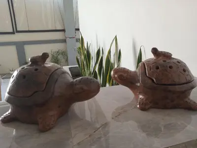 two statues of two turtles sitting on a table at 9 Residence's Seminyak in Seminyak