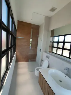 a bathroom with a toilet and a sink and a shower at Milo Modern Five-Bedrooms Villa in Jimbaran