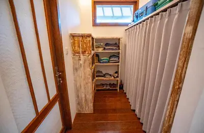 a hallway of a room with white blinds at Villa Jado 2 - 3 Bedroom Villa With Private Pool in Kerobokan